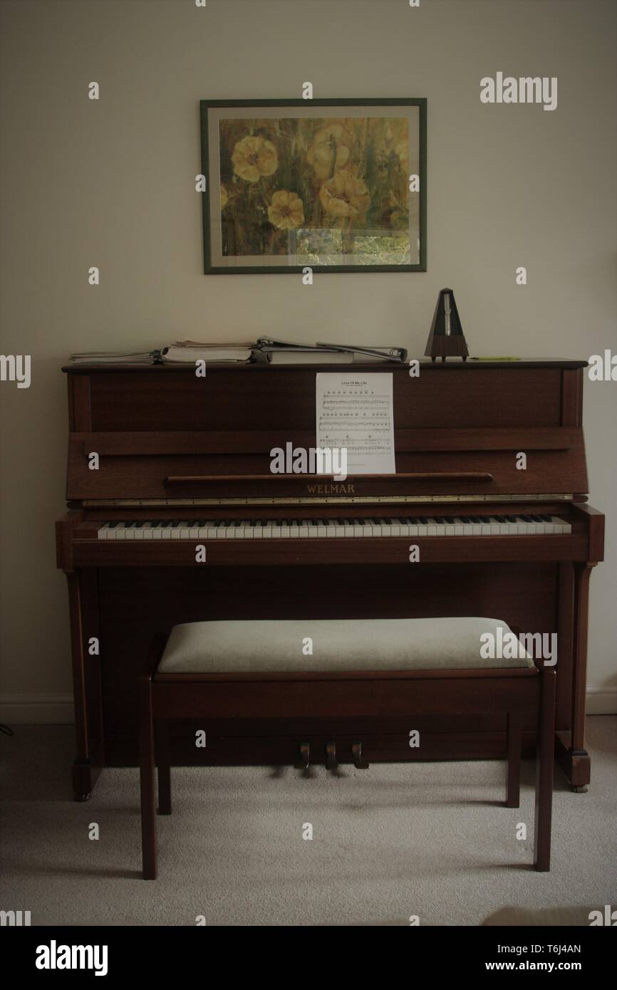 Piano in a living room Stock Photo - Alamy