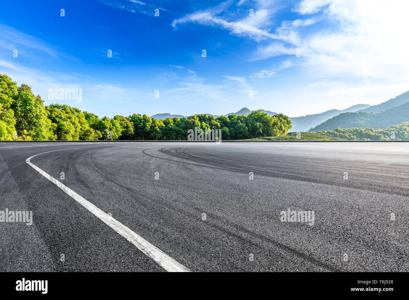 Empty asphalt race track and beautiful natural landscape Stock Photo ...