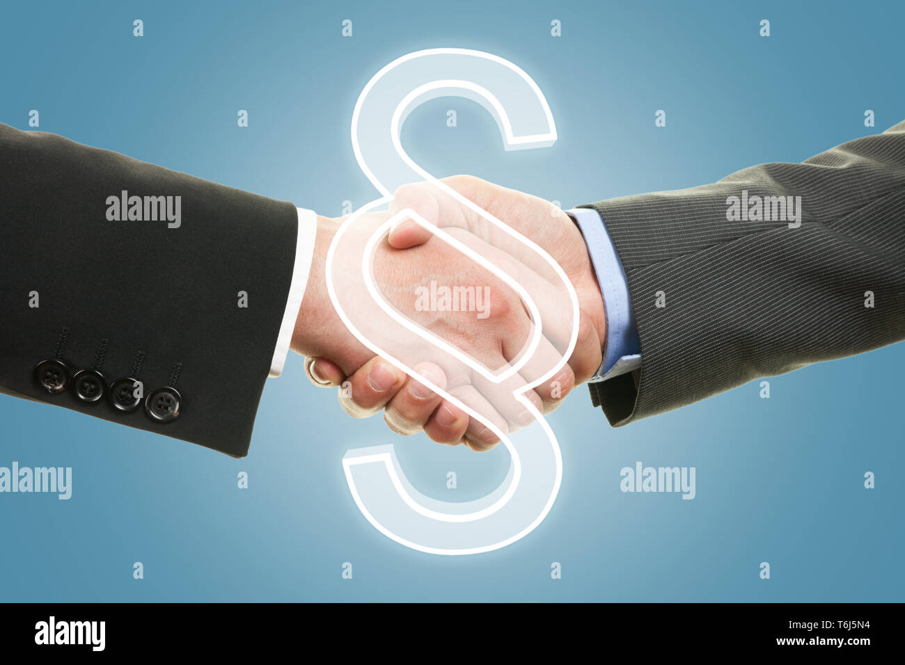 Two lawyers shaking hands - paragraph symbol. Concept for justice. Stock Photo