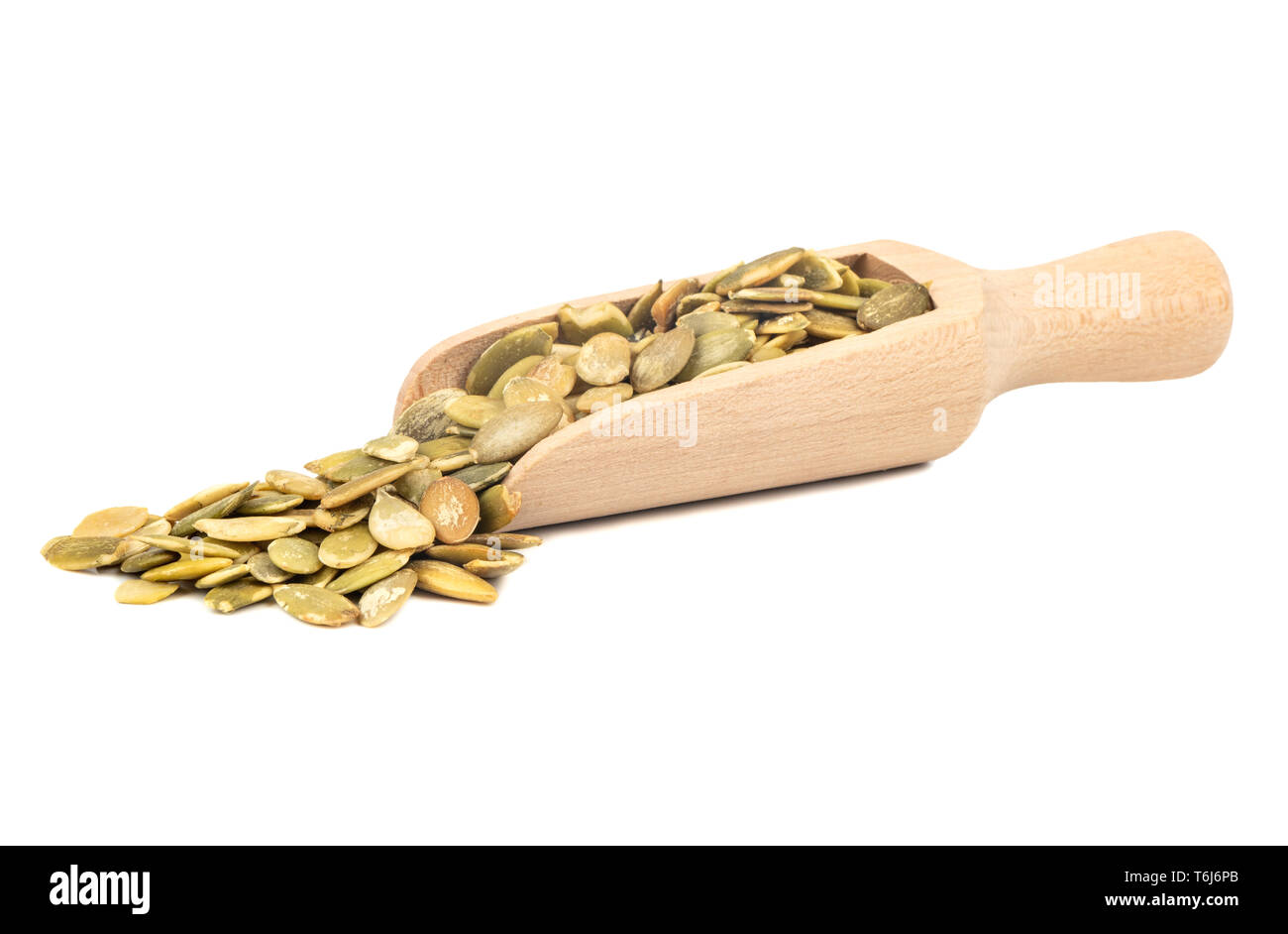 Pumpkin seeds without shell in scoop on white background Stock Photo