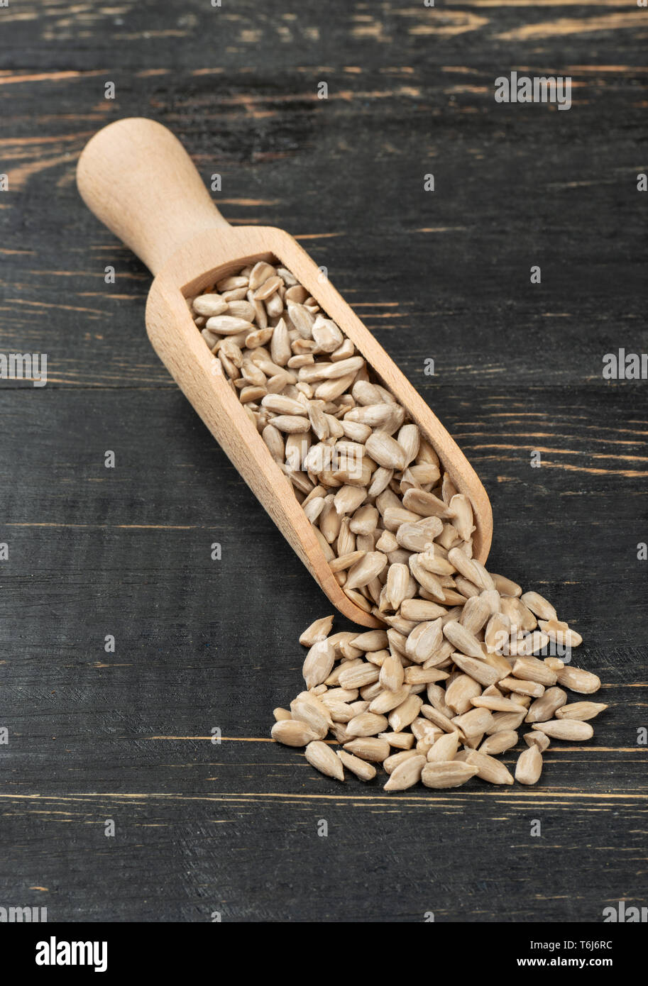 Sunflower seeds without shell in a scoop on a dark table Stock Photo Alamy
