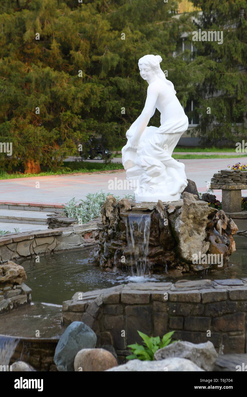 Woman Bathing In Waterfall High Resolution Stock Photography and Images