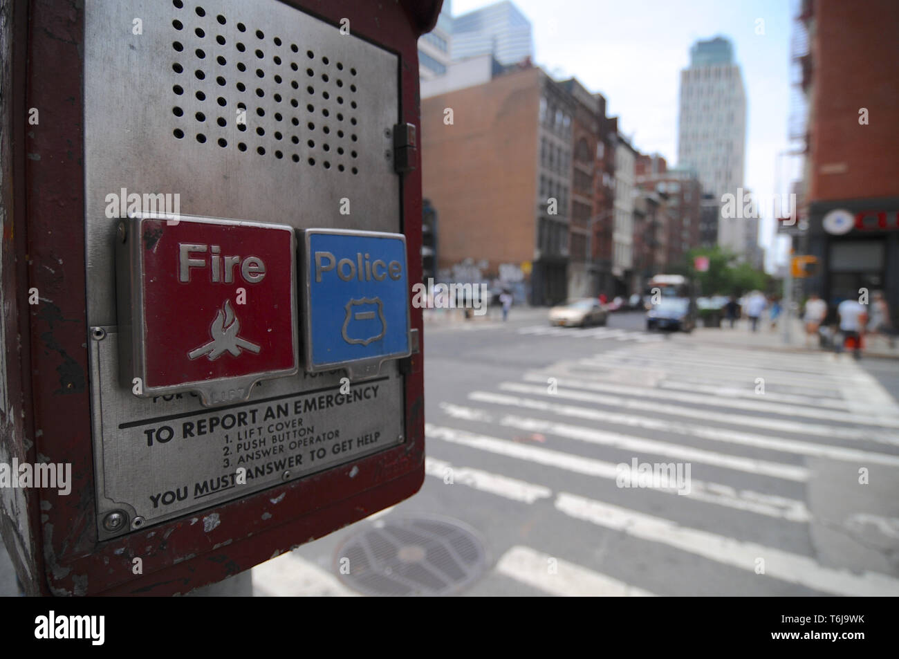 Brooklyn, New York City, USA : 14th July 2014 : Close up picture of a Fire and Police Emergency call box with some buildings in the background located Stock Photo