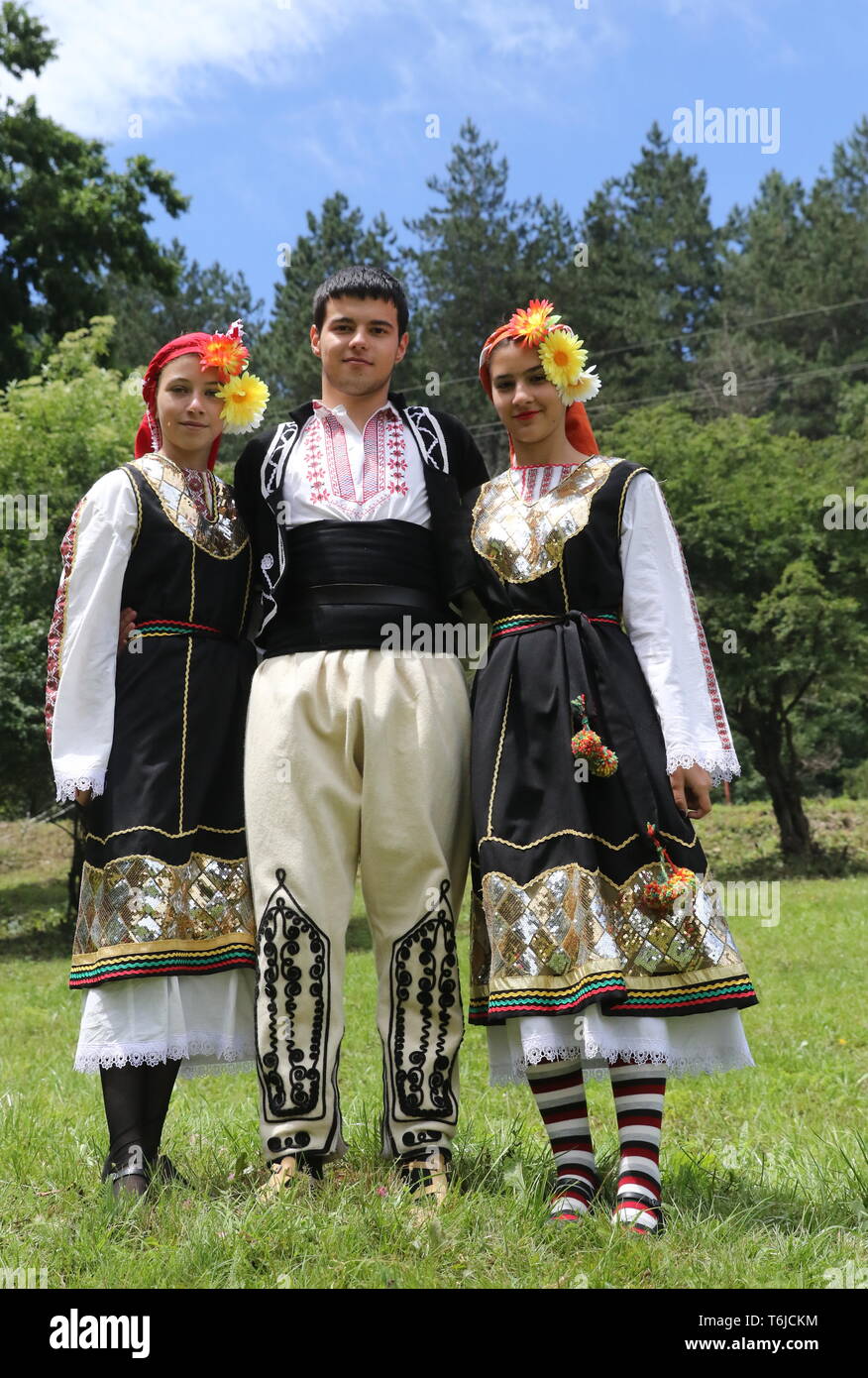 People in traditional authentic folk costumes Stock Photo