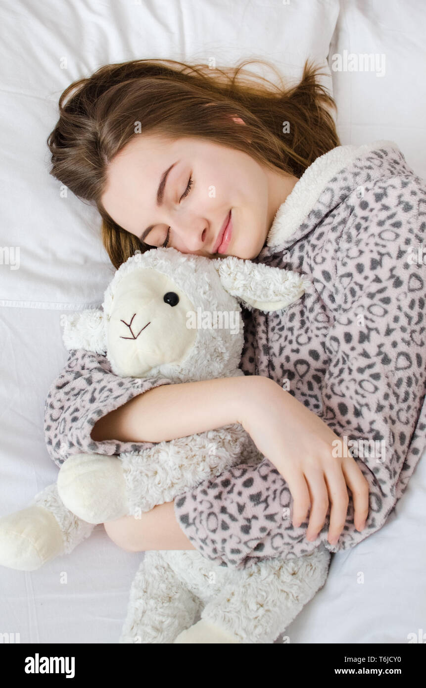 sleeping with a stuffed animal