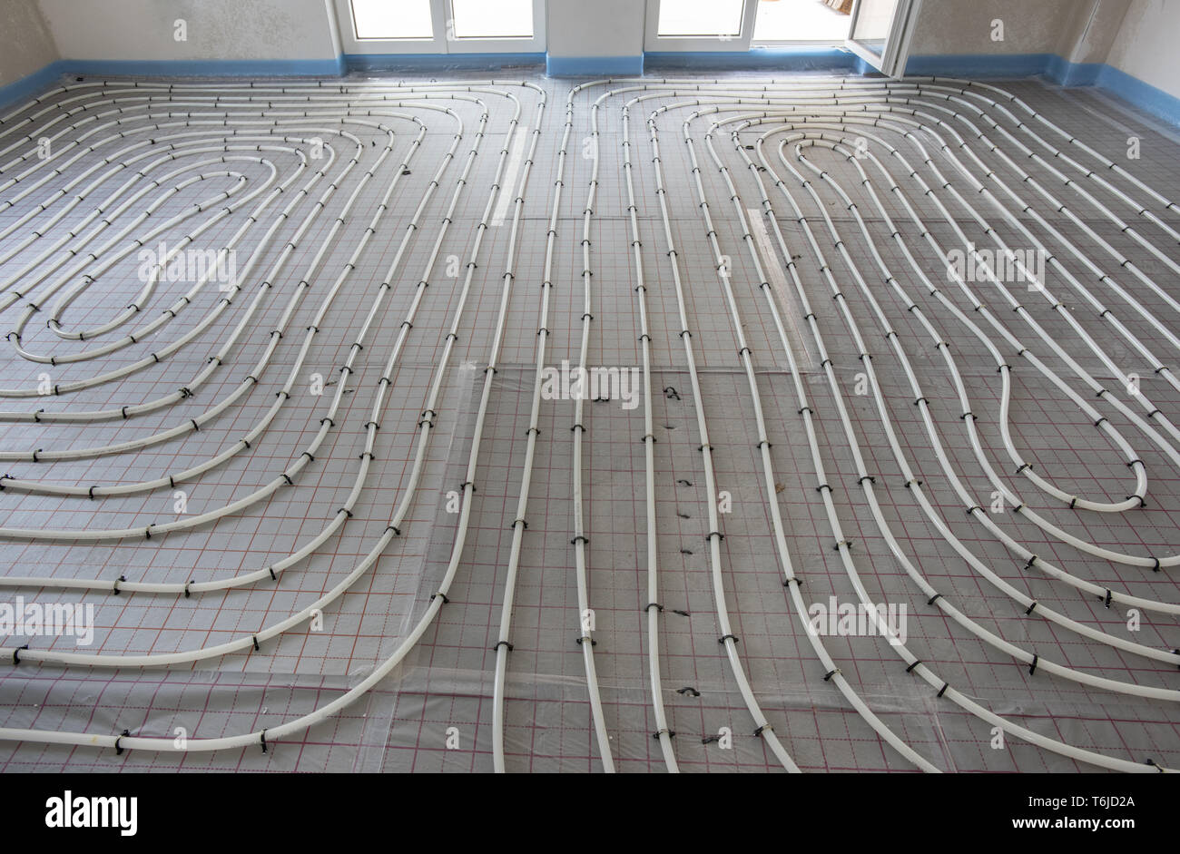 installation of underfloor heating in new built house Stock Photo Alamy