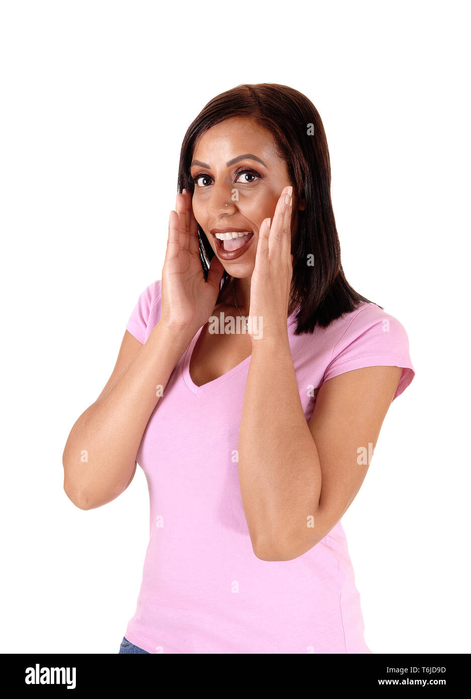 Happy woman holding her hands on face Stock Photo