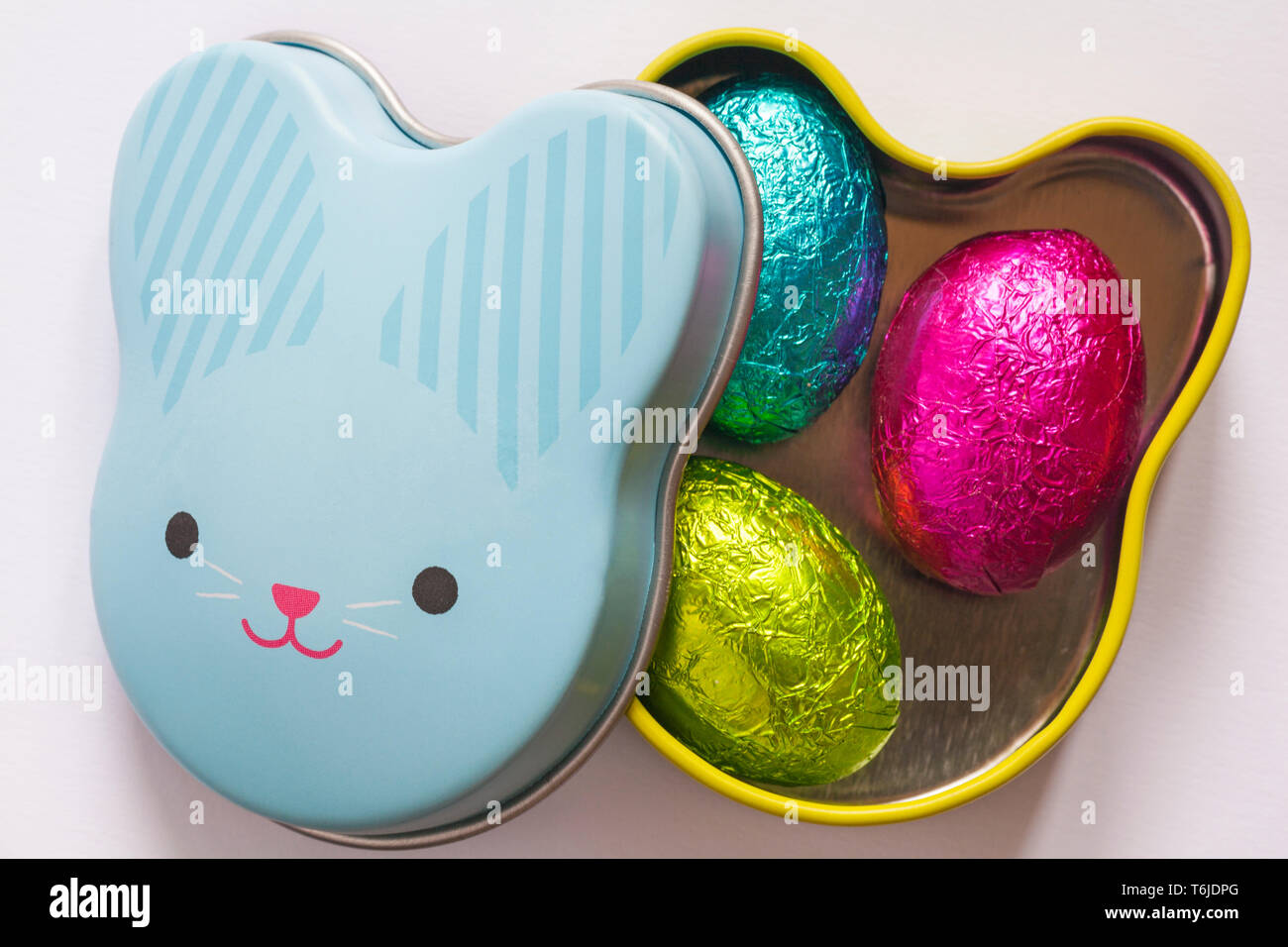 Easter Bunny tin with lid removed showing three foil covered mini