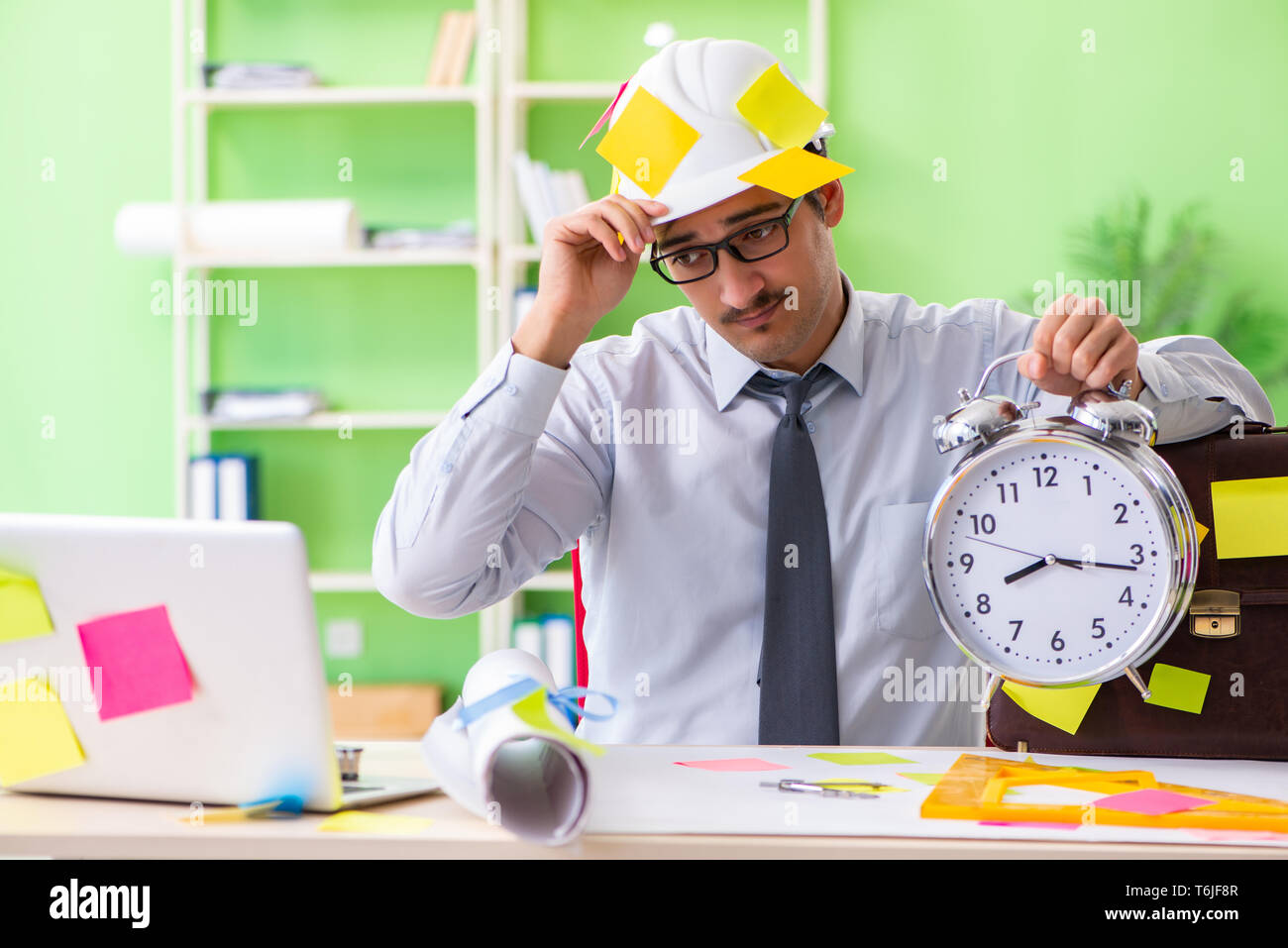 Male engineer working on new project with many conflicting prior Stock ...