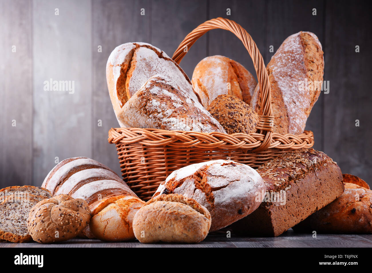 Composition with assorted bakery products in wicker basket Stock Photo