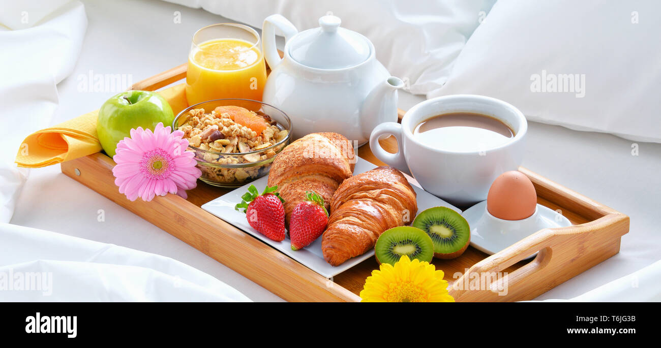 Breakfast tray in bed in hotel room Stock Photo - Alamy