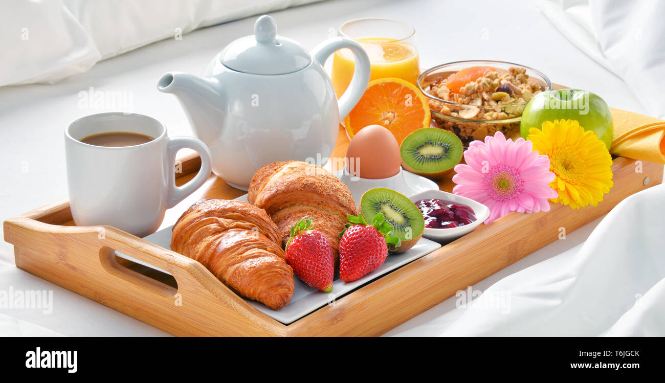 Breakfast tray in bed in hotel room Stock Photo Alamy
