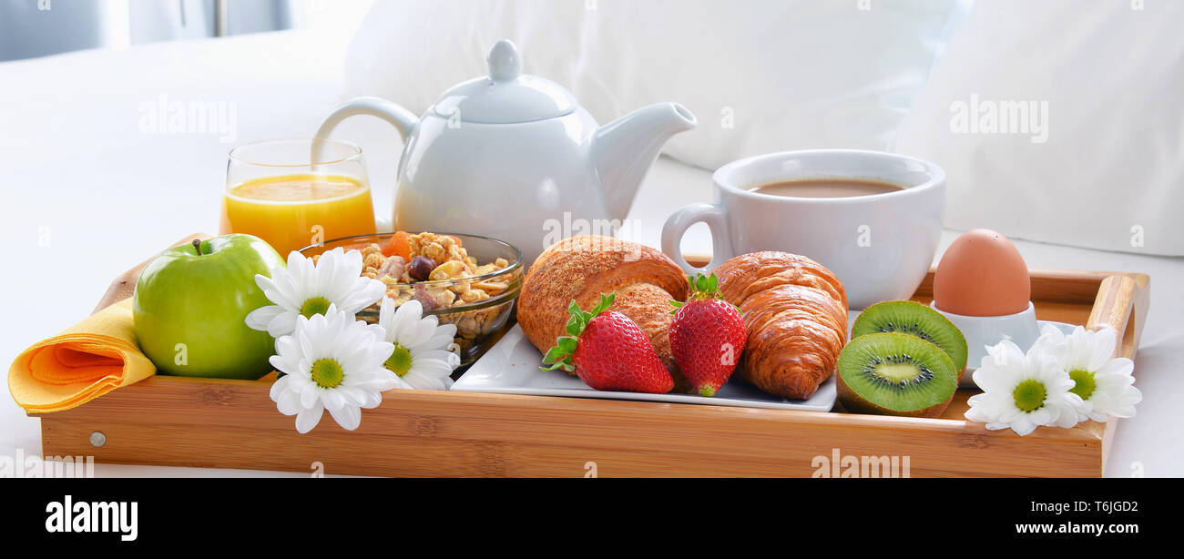 Breakfast tray in bed in hotel room Stock Photo - Alamy