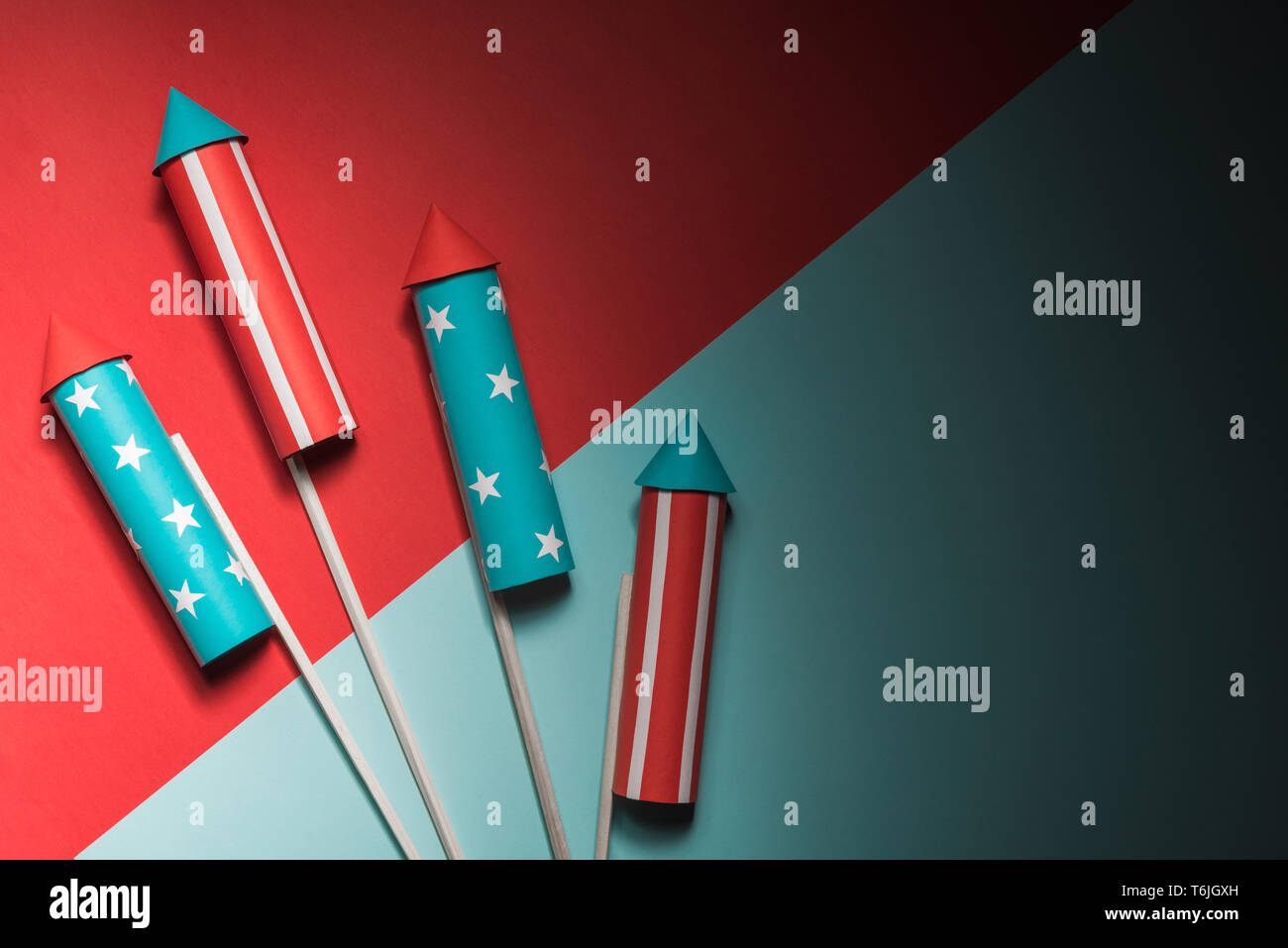 July 4, rockets for fireworks on a blue red background with space for ...