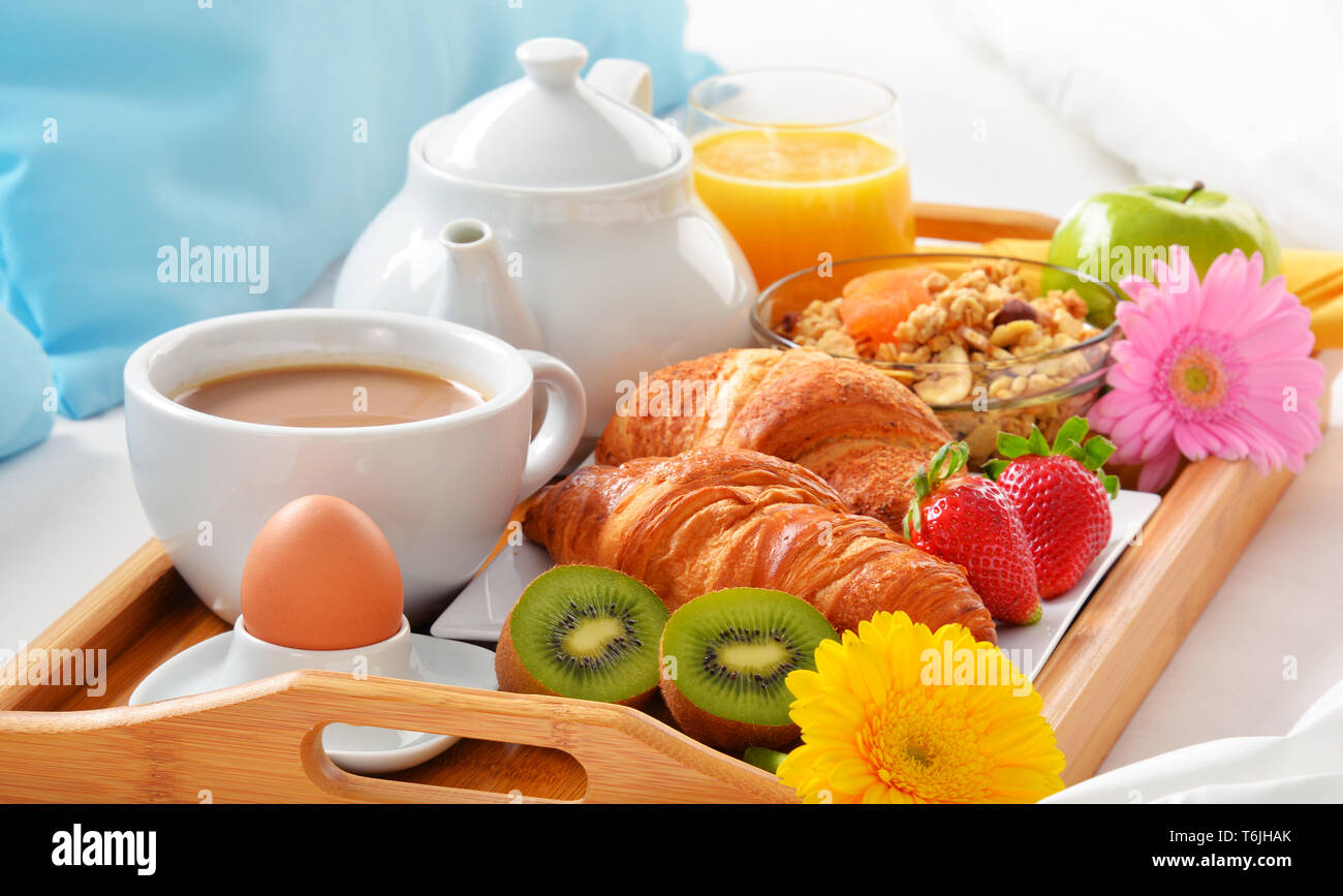 Breakfast tray in bed in hotel room Stock Photo Alamy