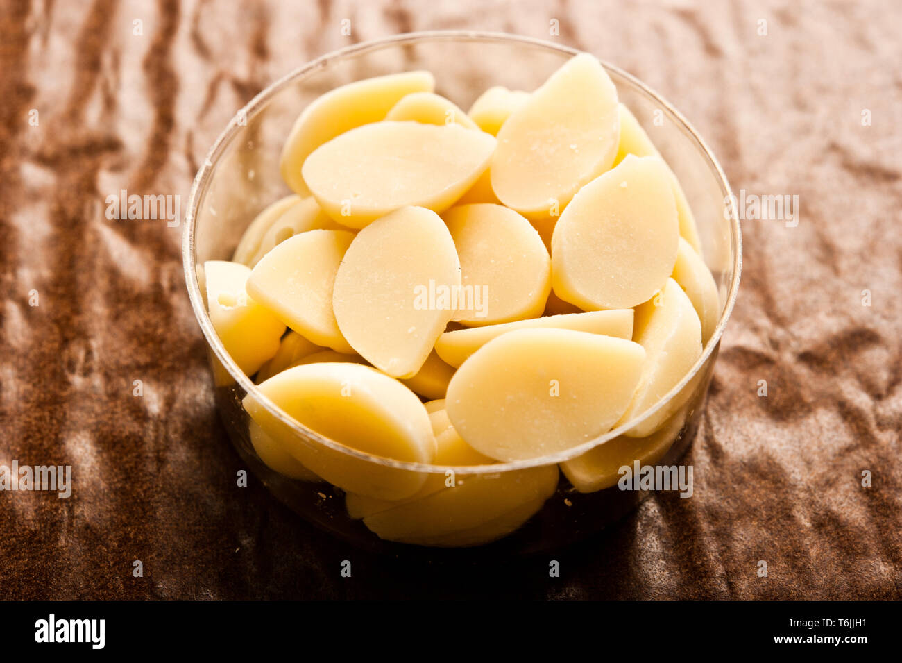 cocoa butter chips in a bowl Stock Photo Alamy