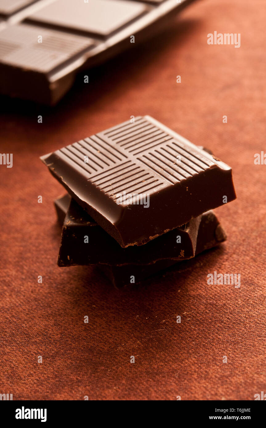 pieces of a chocolate tablet stacked Stock Photo