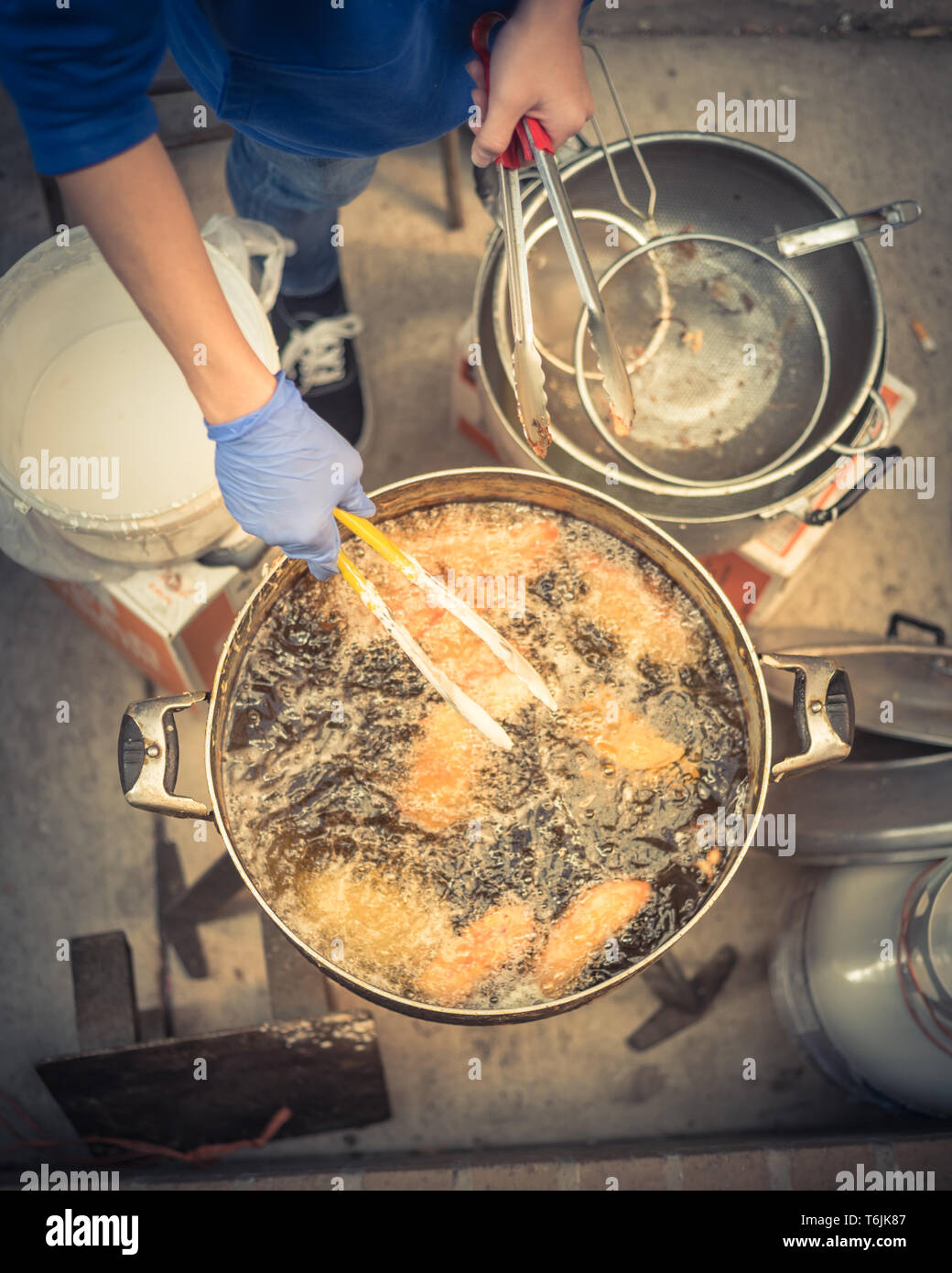 Closeup top view deep fried rice flour cakes in hot and flaming oil