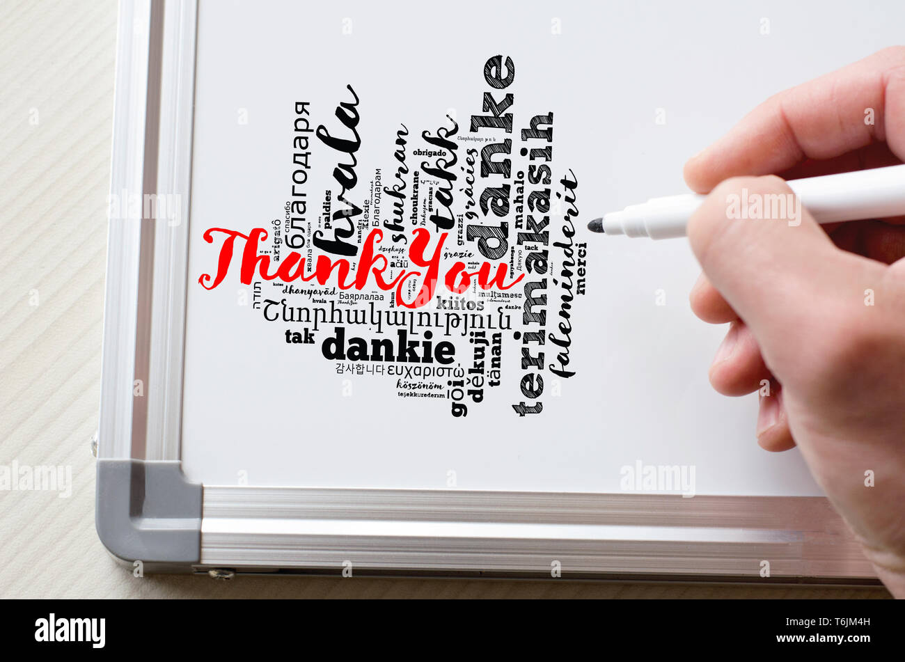 Thank You word cloud in different languages with marker and whiteboard Stock Photo