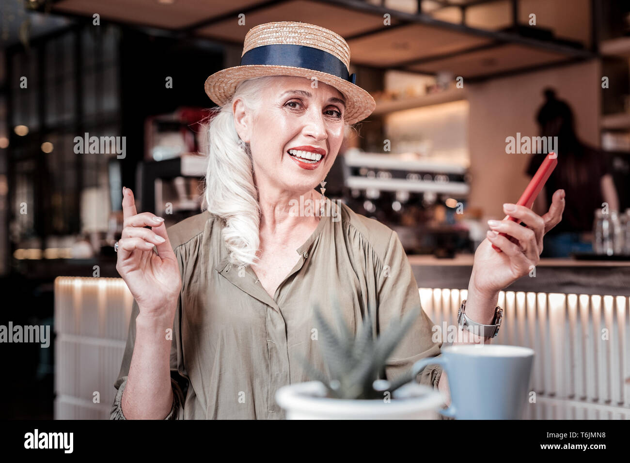 Woman wearing grey hat hi-res stock photography and images - Alamy