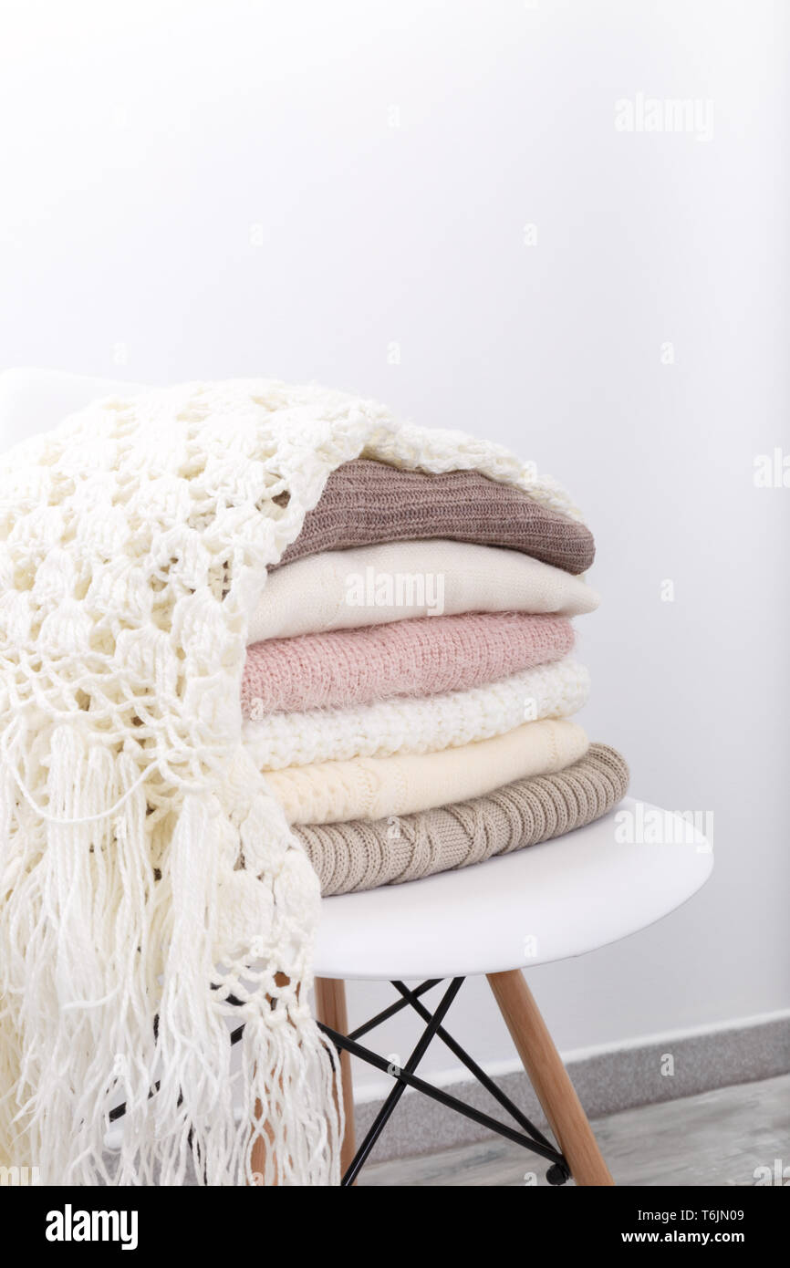 Stack of cozy knitted sweaters Stock Photo