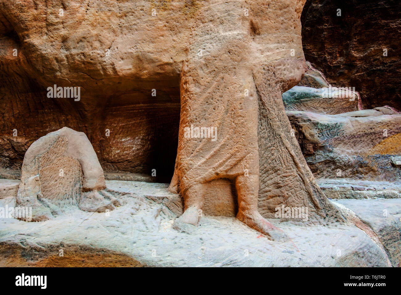 Sculpture by covered water channel used to bring water from the spring in Wadi Musa into the center of Petra. Stock Photo