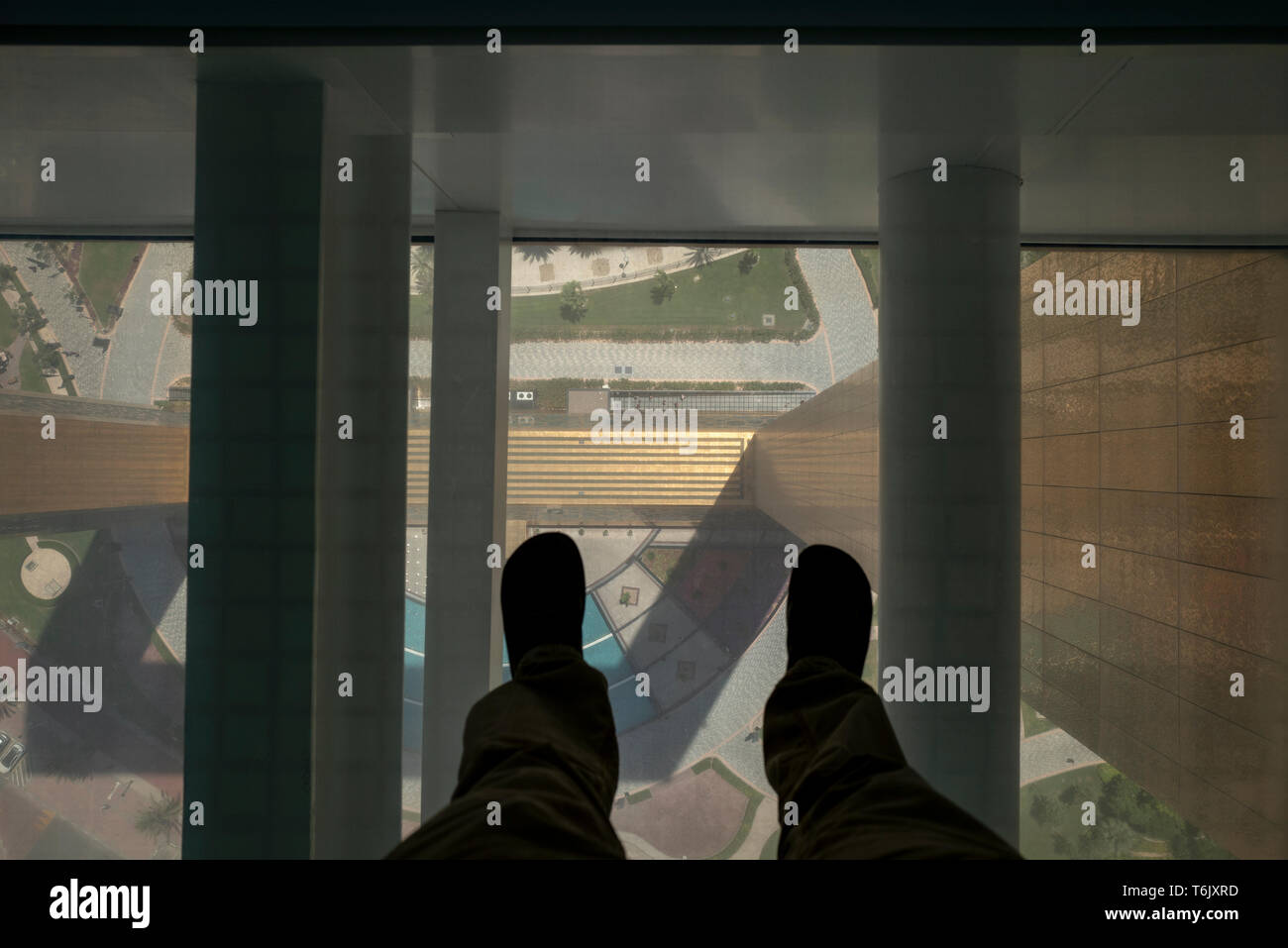 Standing on the glass walkway on The Dubai Frame new tourist attraction in Dubai, UAE Stock Photo