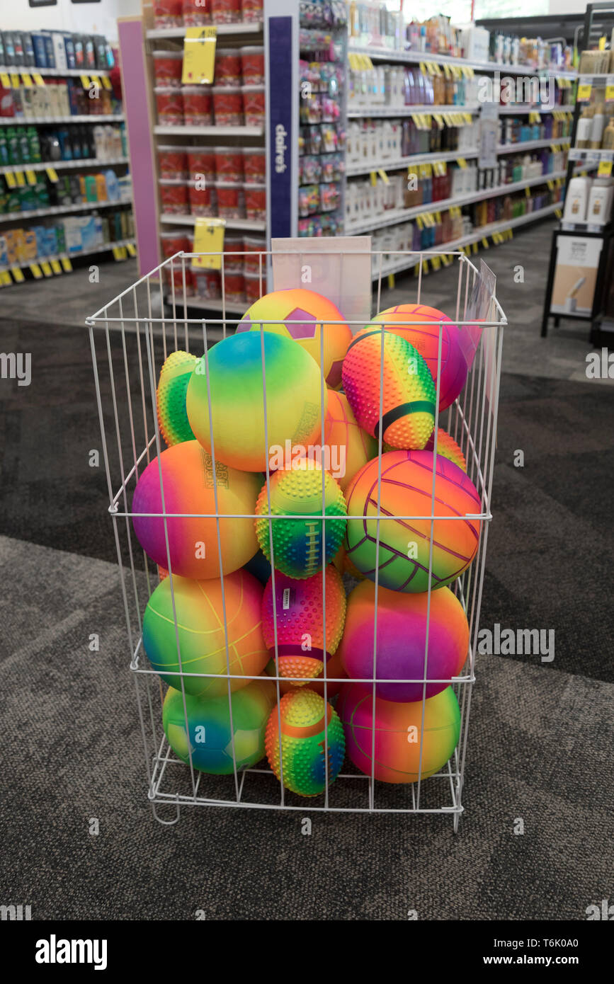 A bin full of colored balls for sale in a drug store. Stock Photo