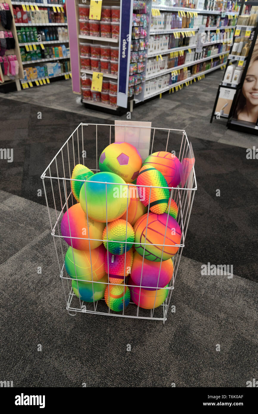 A bin full of colored balls for sale in a drug store. Stock Photo