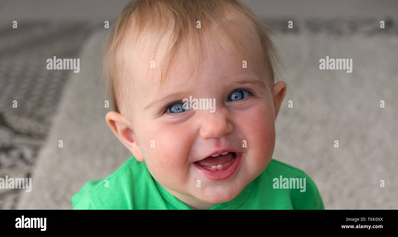 Adorable baby smiles and laughs Stock Photo