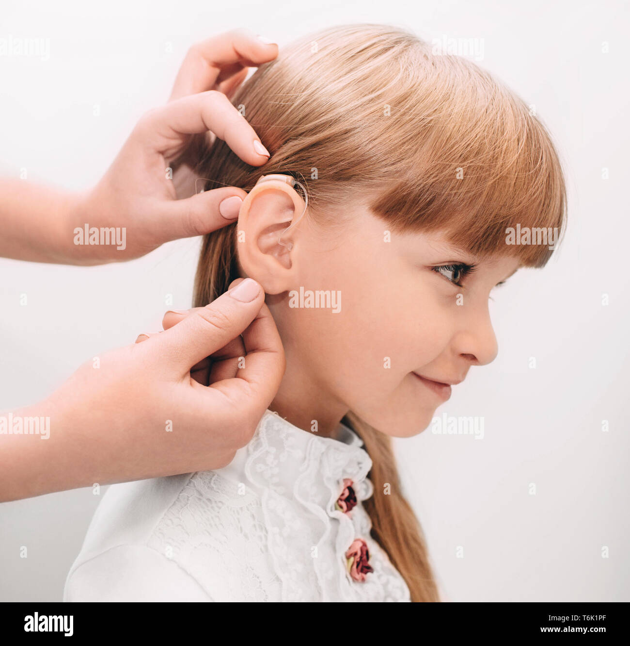 Child hearing aid hires stock photography and images Alamy