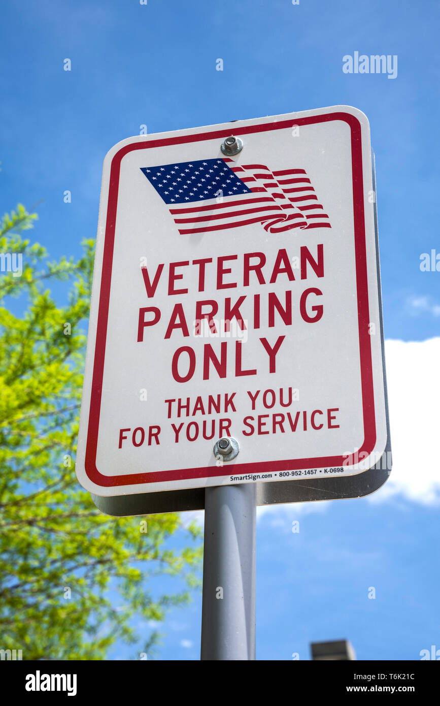 Veterans parking only sign in a home improvement store parking lot. Stock Photo