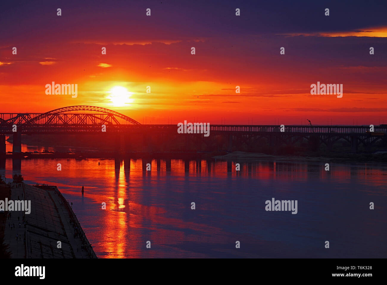 summer sunset over the river bridge Stock Photo