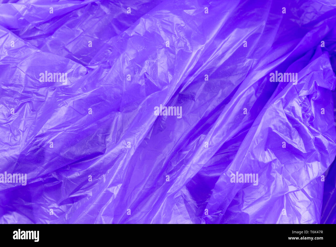 https://c8.alamy.com/comp/T6K47R/abstract-texture-of-purple-cellophane-garbage-bag-macro-close-up-background-T6K47R.jpg