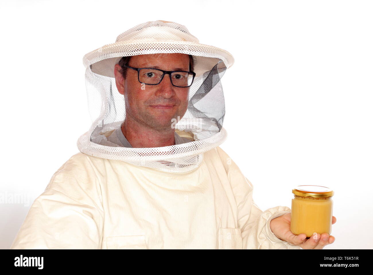apiarist with honey glass Stock Photo