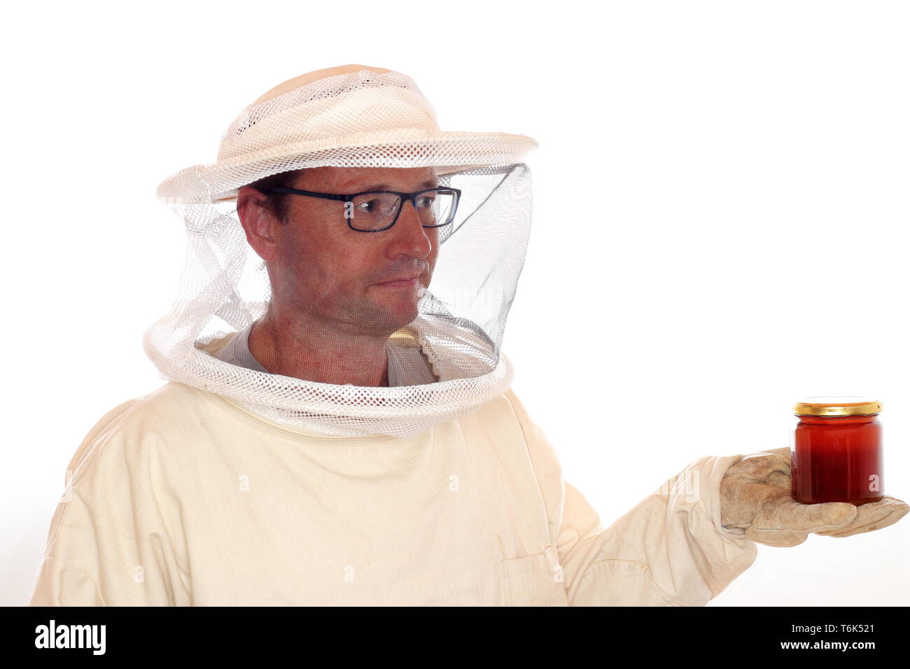 apiarist with honey Stock Photo