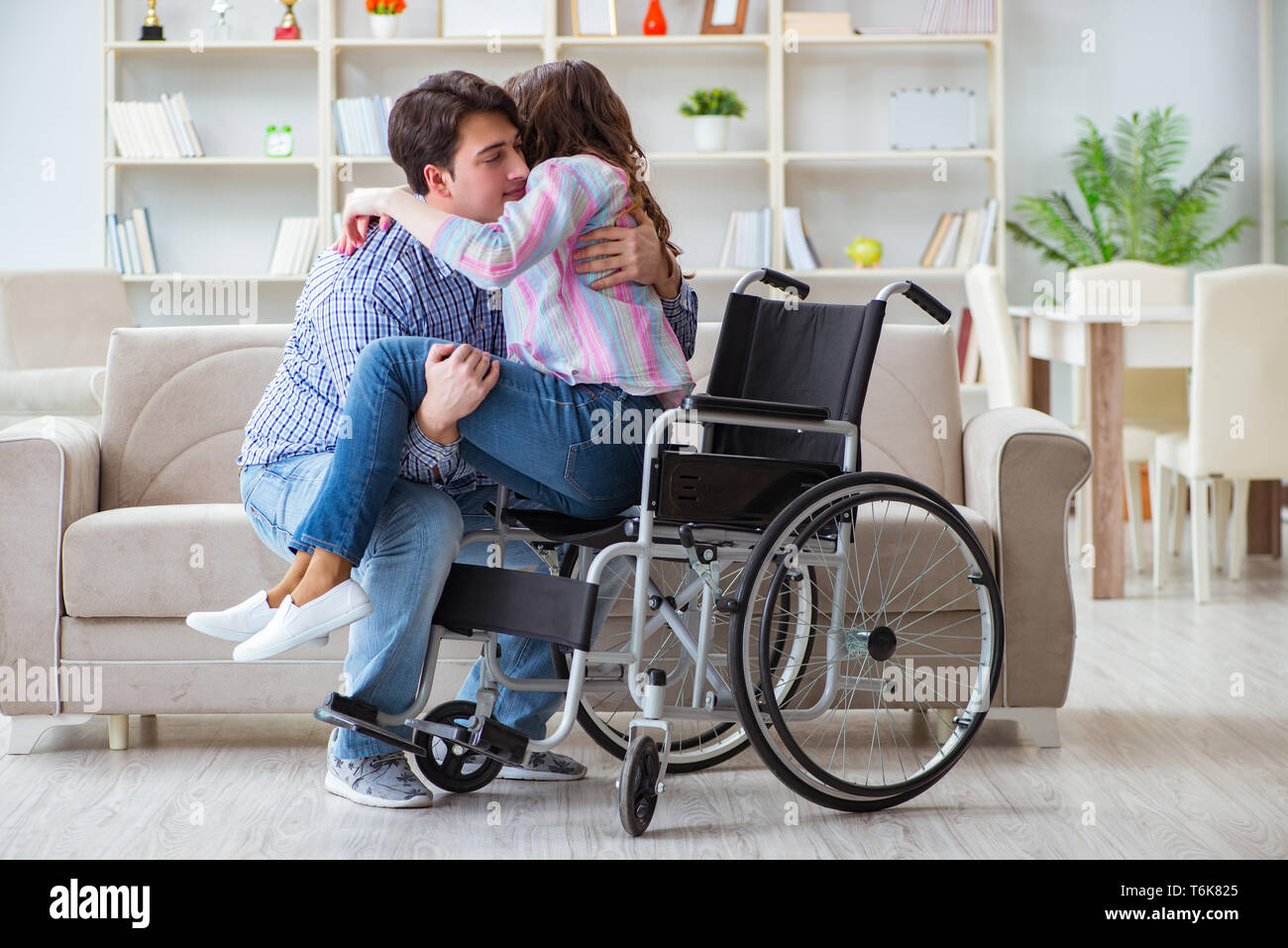 The Young Family Taking Care Of Each Other Stock Photo Alamy
