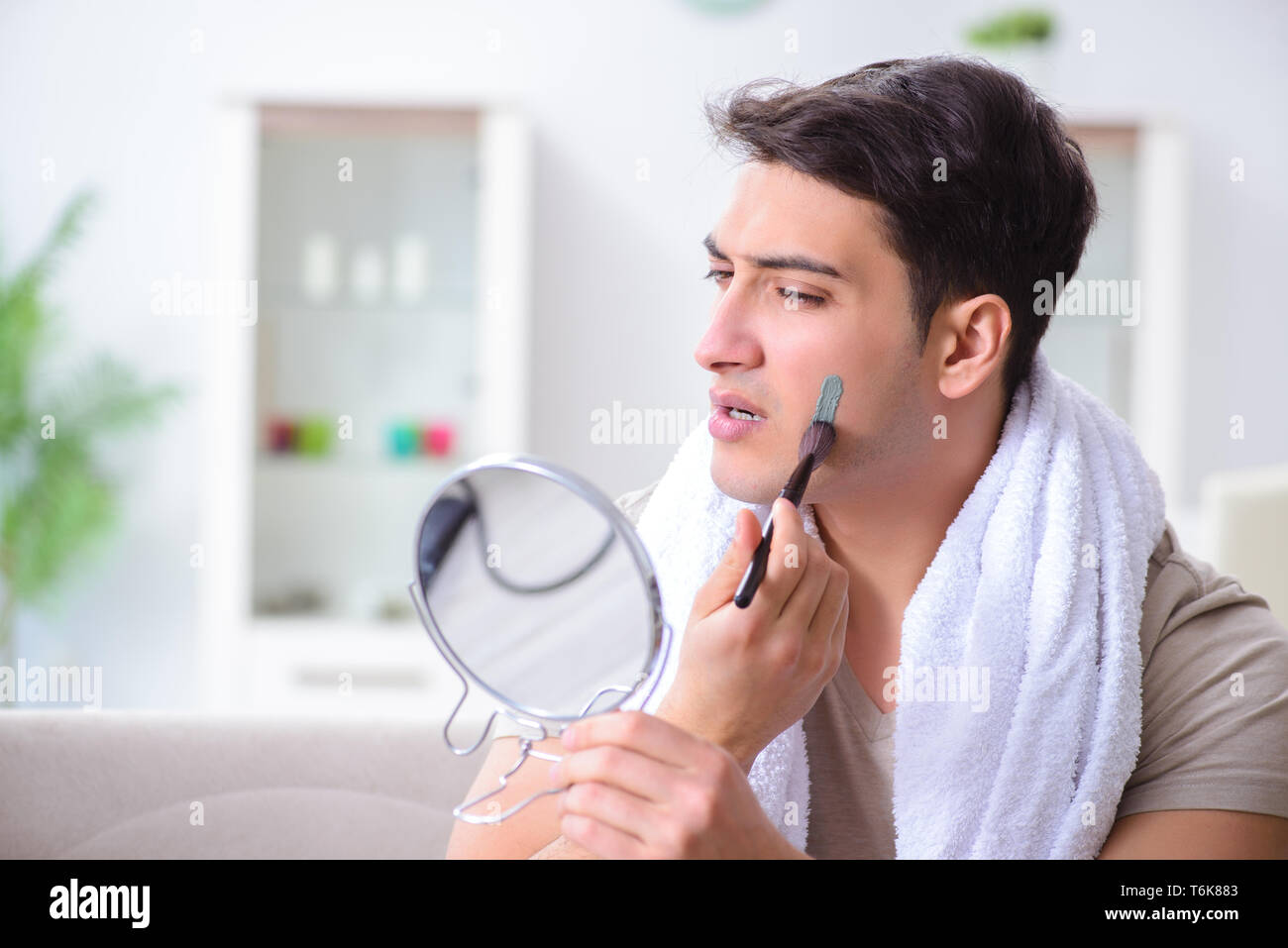 Man peeling off mask hi-res stock photography and images - Alamy