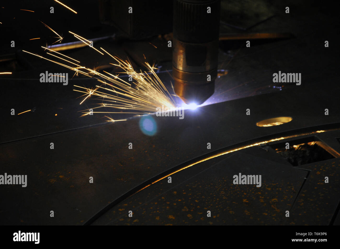 laser cutting torch machine in an industrial plant cuts sheet metal