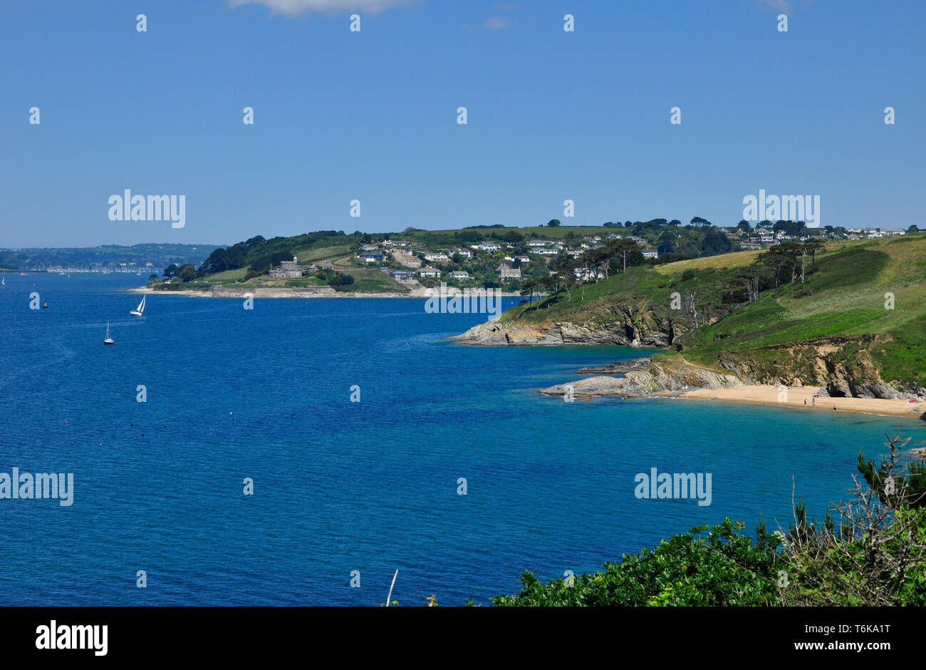 View from the coastal path on St Anthony's Head towards  Henry VIII's coastal artillery fortress of St Mawes castle in Cornwall, England ,UK Stock Photo