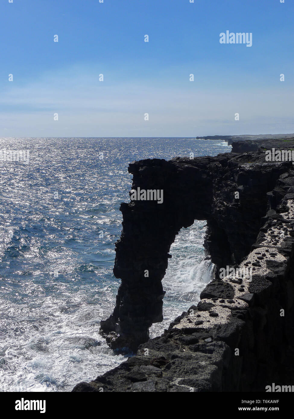 Holei sea arch at Big Island, Hawaii. A natural from lava stone originated arch. Stock Photo