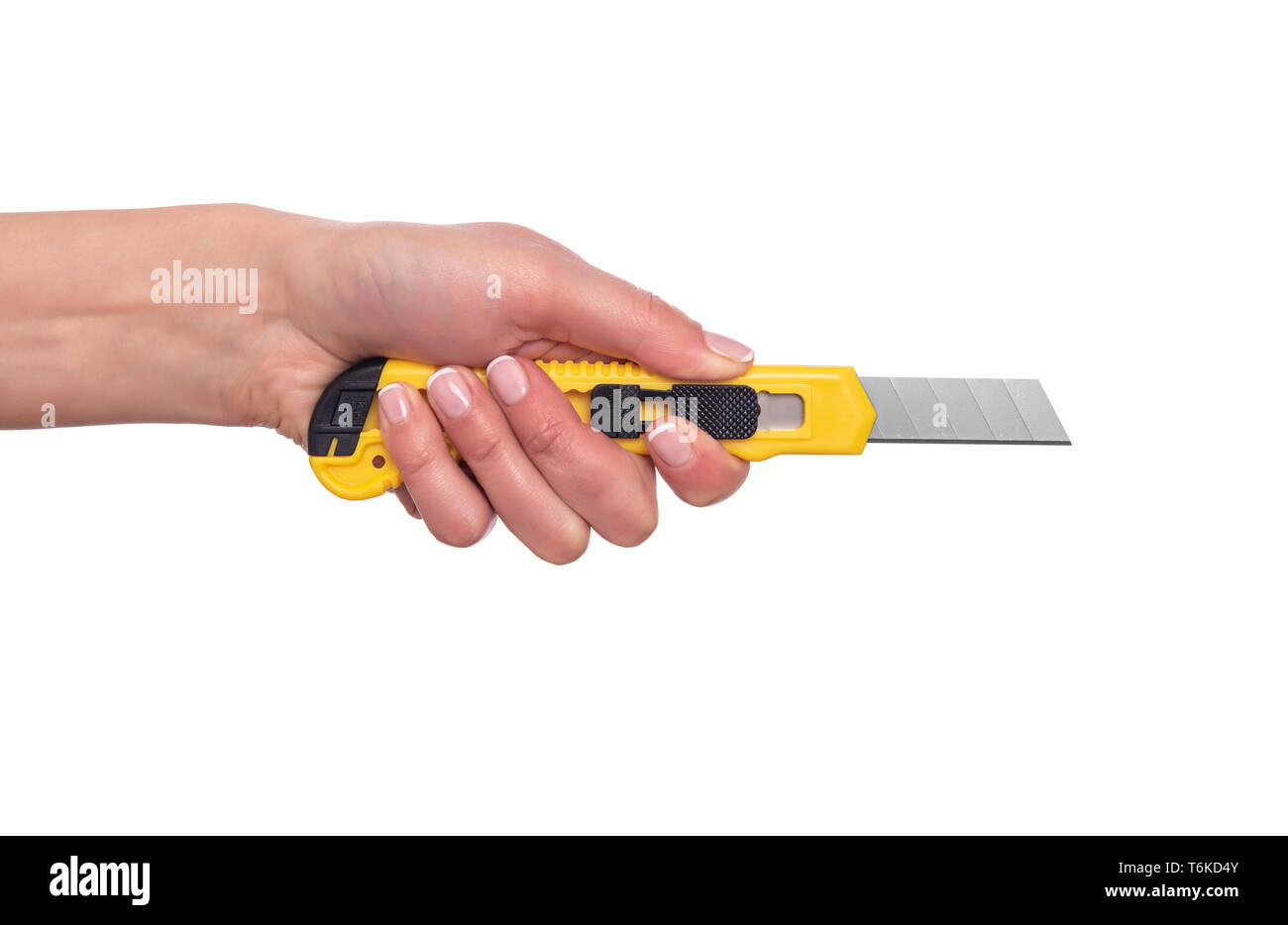 Stationery knife in a female hand on white background Stock Photo Alamy