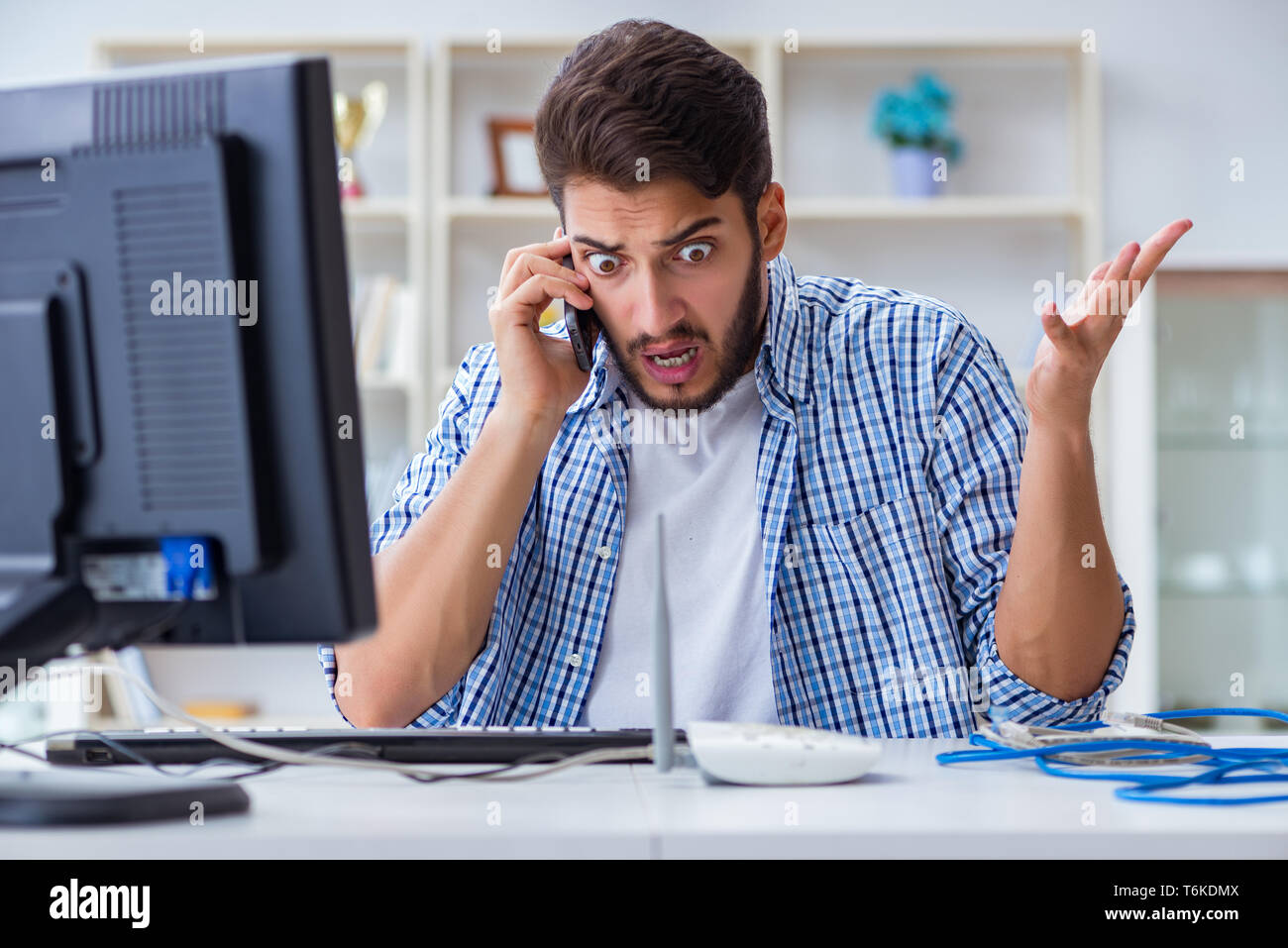Frustrated young man due to weak internet reception Stock Photo - Alamy