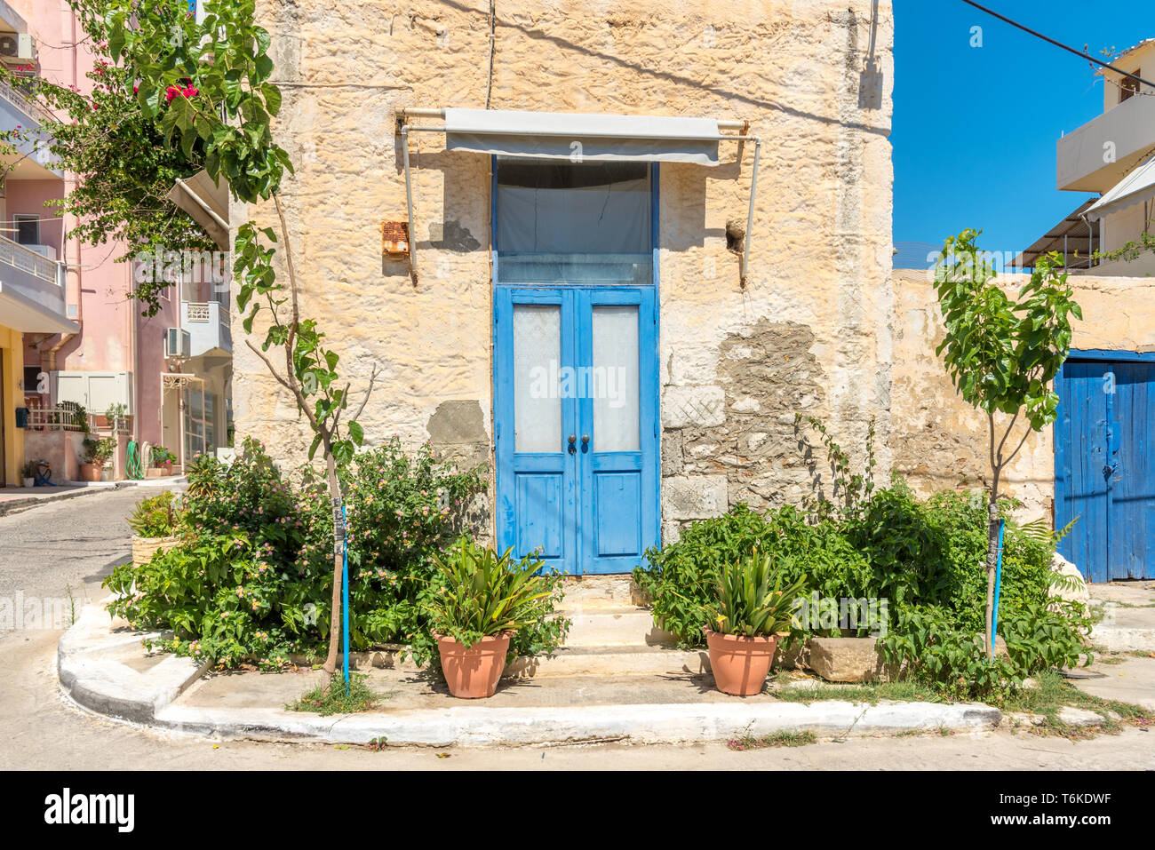 Blue front door of an old stylish house in Paleochora Stock Photo - Alamy