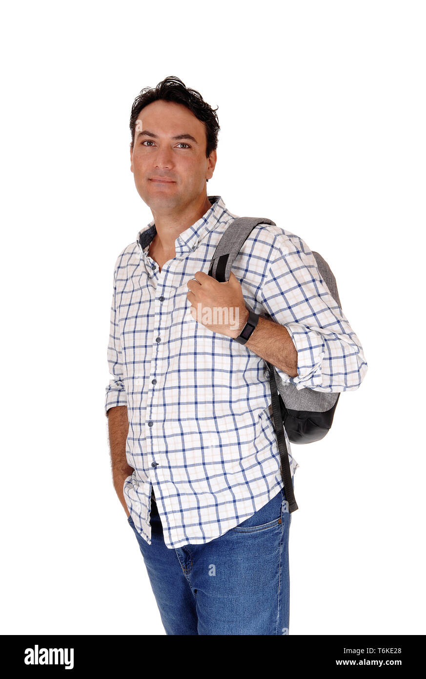 Young man standing with his backpack Stock Photo