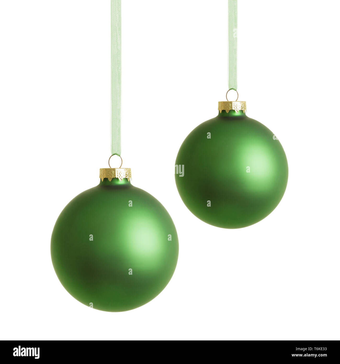 Hanging green christmas baubles isolated on white background. Stock Photo