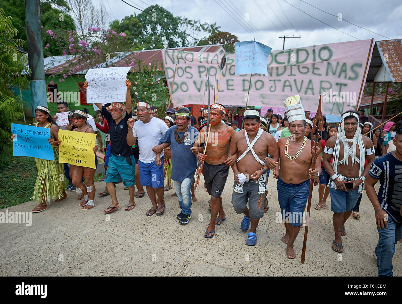 Indigenous people march through Atalaia do Norte in Brazil's Amazon region, protesting a central government plan to municipalize health care. Stock Photo