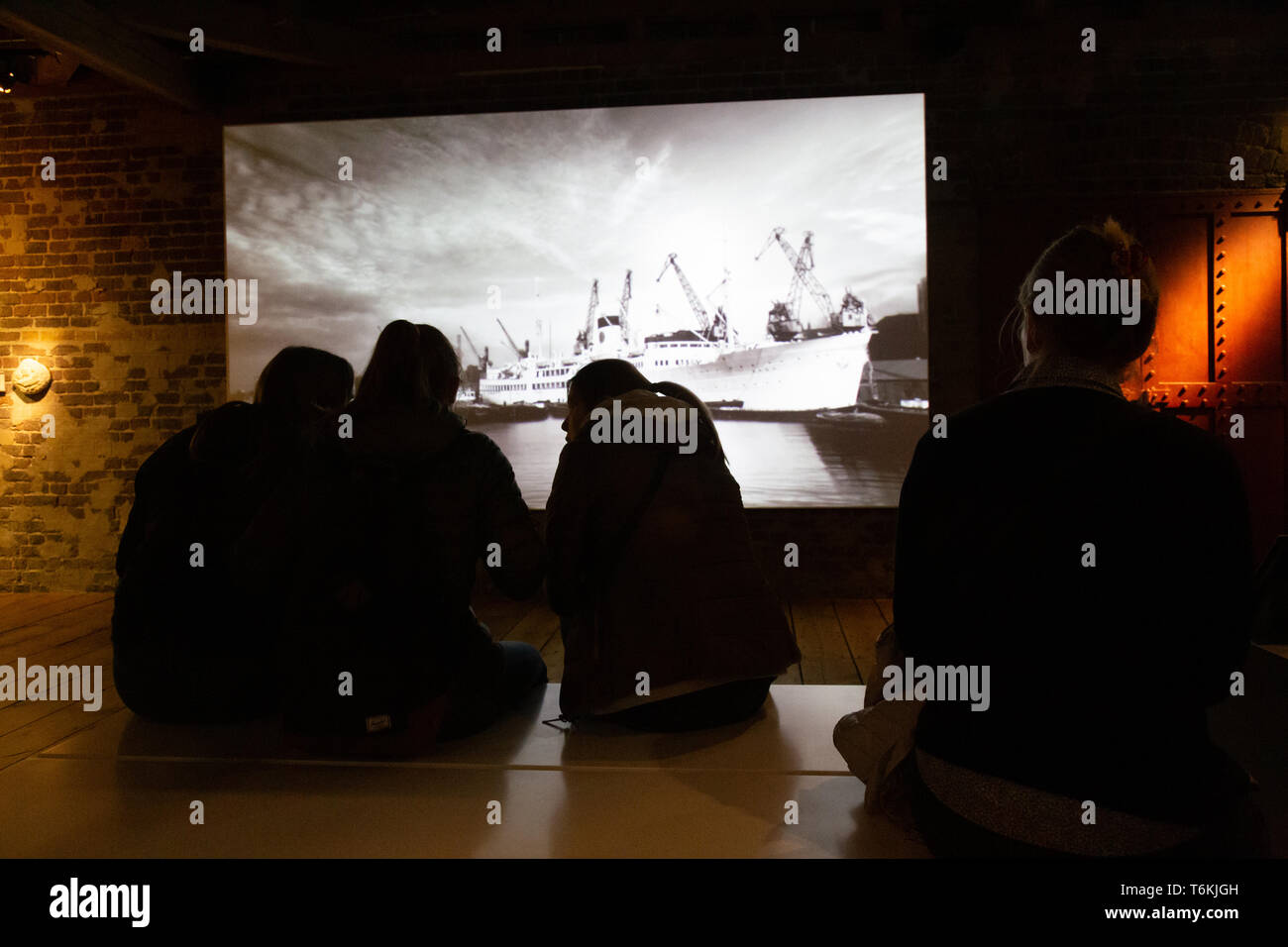 Film projection of the maritime history at the Docklands museum of London. Stock Photo