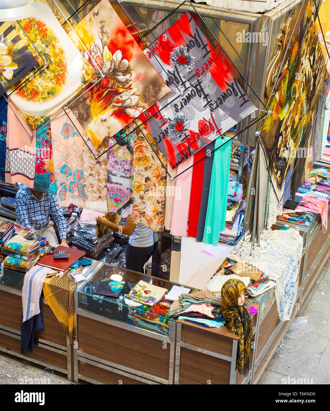 Silk fabrics, textiles and colorful shawls at Grand Bazaar market. Tehran, Iran Stock Photo