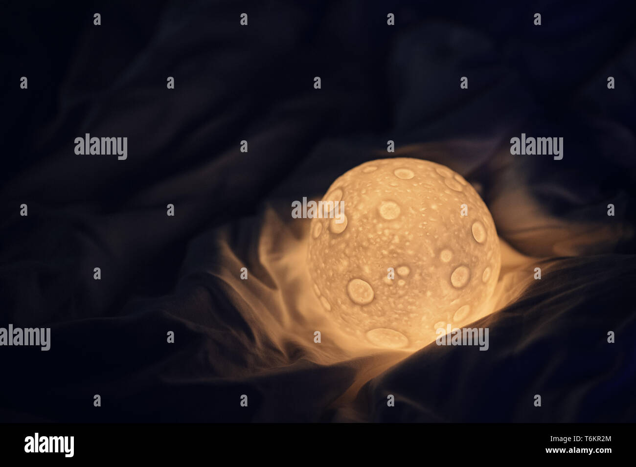 decorative moon lamp in bed Stock Photo Alamy